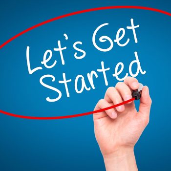 Man Hand writing Lets Get Started  with black marker on visual screen. Isolated on blue. Business, technology, internet concept. Stock Photo